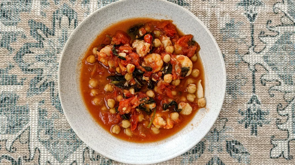 Photograph of All-in-one fish, chickpea & spinach stew.