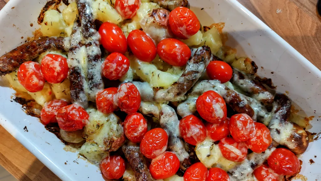 Photograph of All-in one sausage and crispy potato bake.