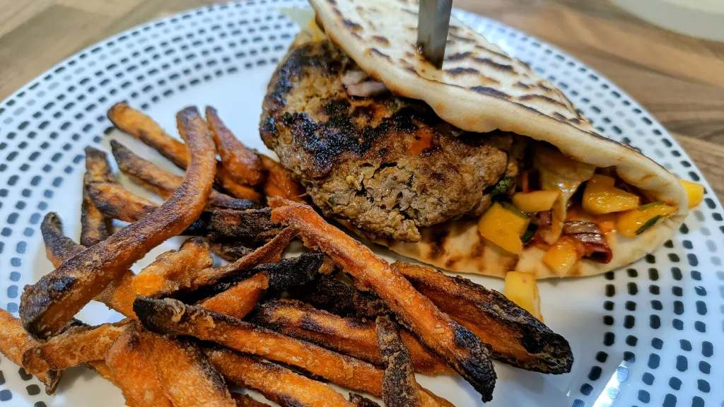 Photograph of Asian spiced burgers with mango salsa.