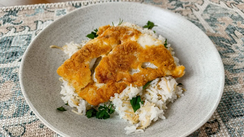 Photograph of Baked cod with lemon and garlic.