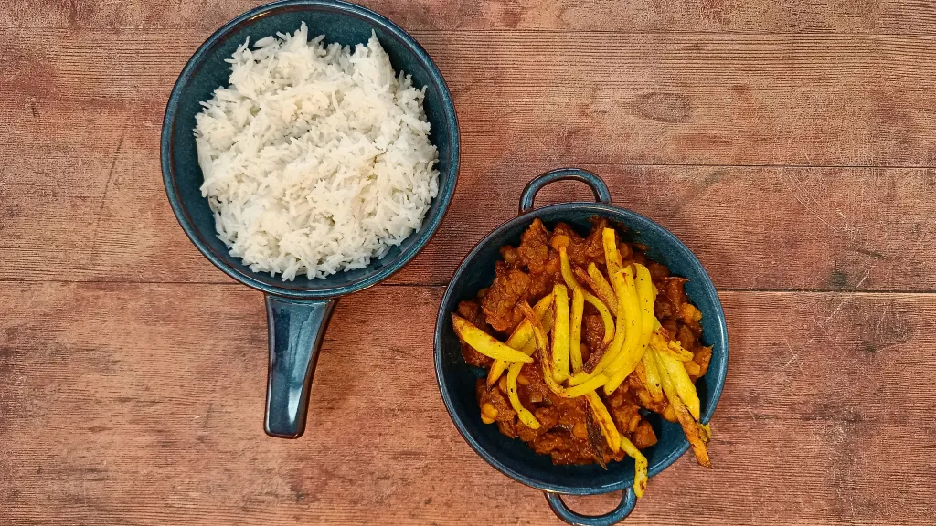 Photograph of Beef and yellow split pea stew with crispy potatoes.