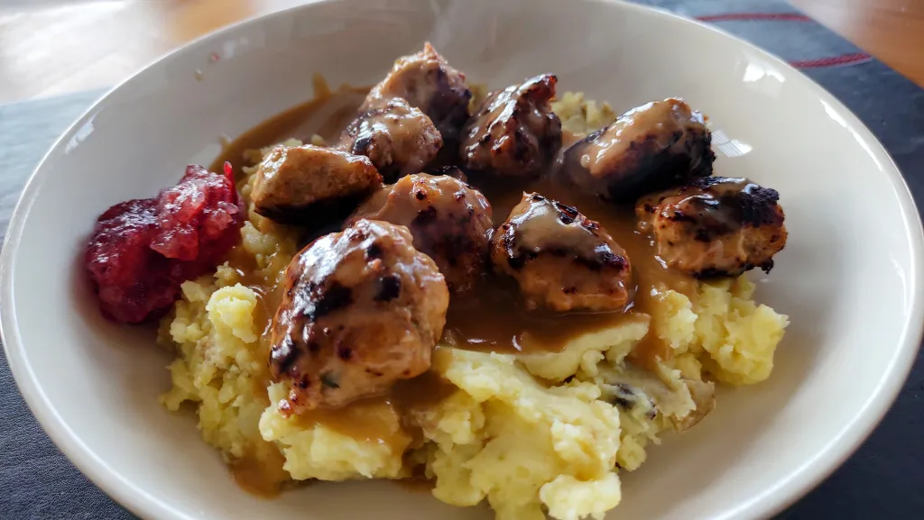 Photograph of Bramley apple meatballs with bramley apple, cranberry sauce.
