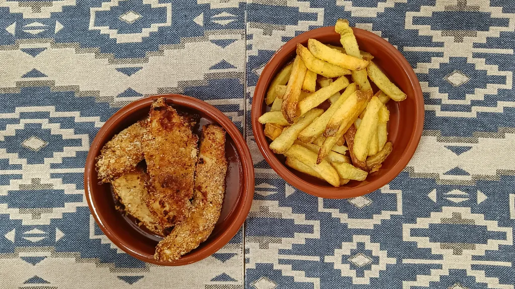 Photograph of Cajun-style chicken fillets.