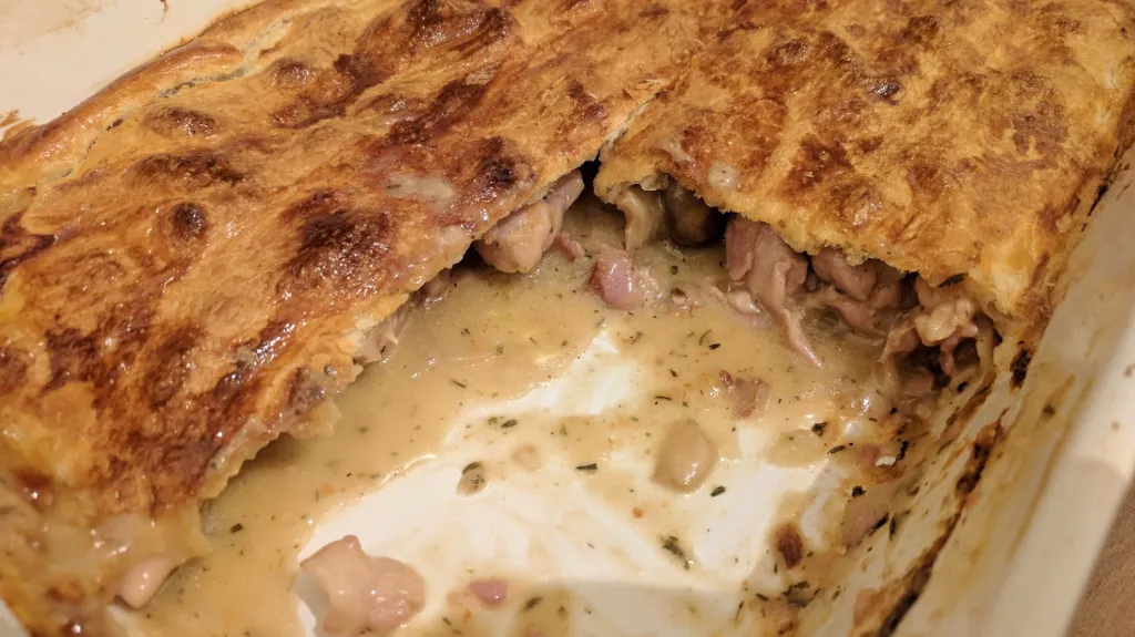 Photograph of Chicken & mushroom puff pie.
