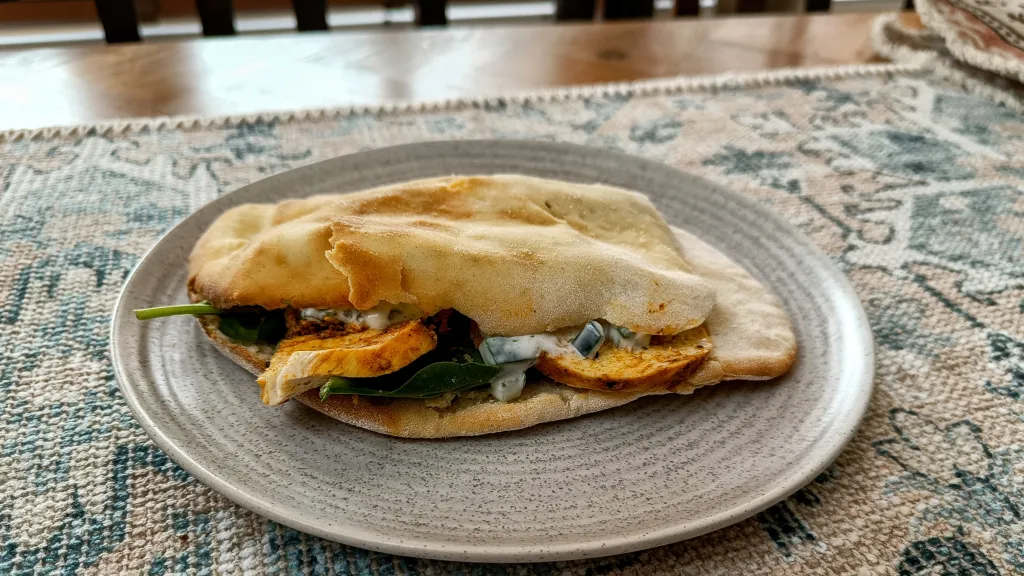 Photograph of Chicken tikka naanwhich.