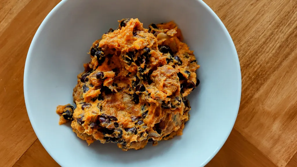 Photograph of Chorizo and black bean loaded sweet potato boats.