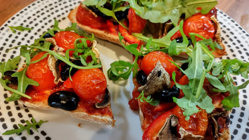 Photograph of Ciabatta pizza with tahini balsamic drizzle.