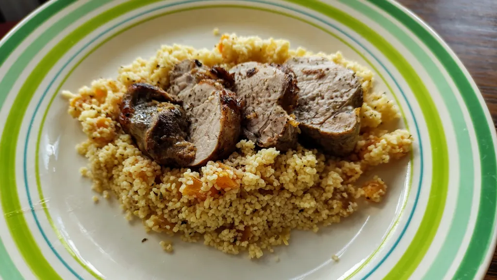 Photograph of Cinnamon-lemon pork with apricot couscous.