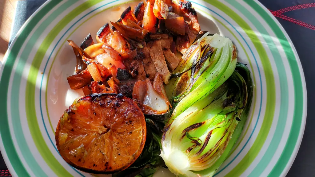 Photograph of Citrus-glazed pork chops with gingery bok choy.
