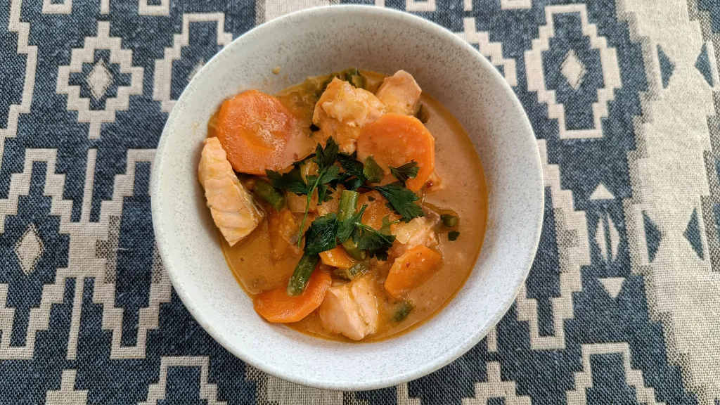 Photograph of Coconut curry fish soup.