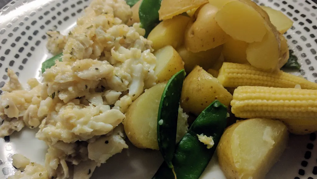 Photograph of Cod with lemon and parsley.