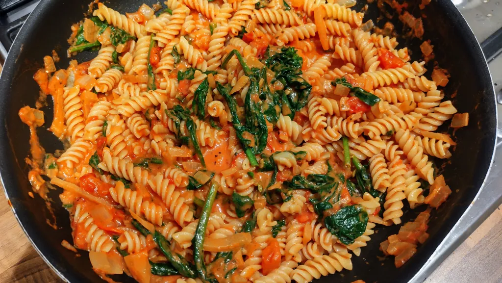 Photograph of Creamy tomato and spinach pasta.