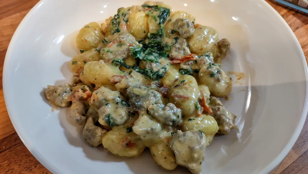Photograph of Creamy tuscan sausage gnocchi.