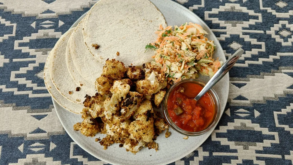 Photograph of Crispy cajun cauli tacos and slaw.