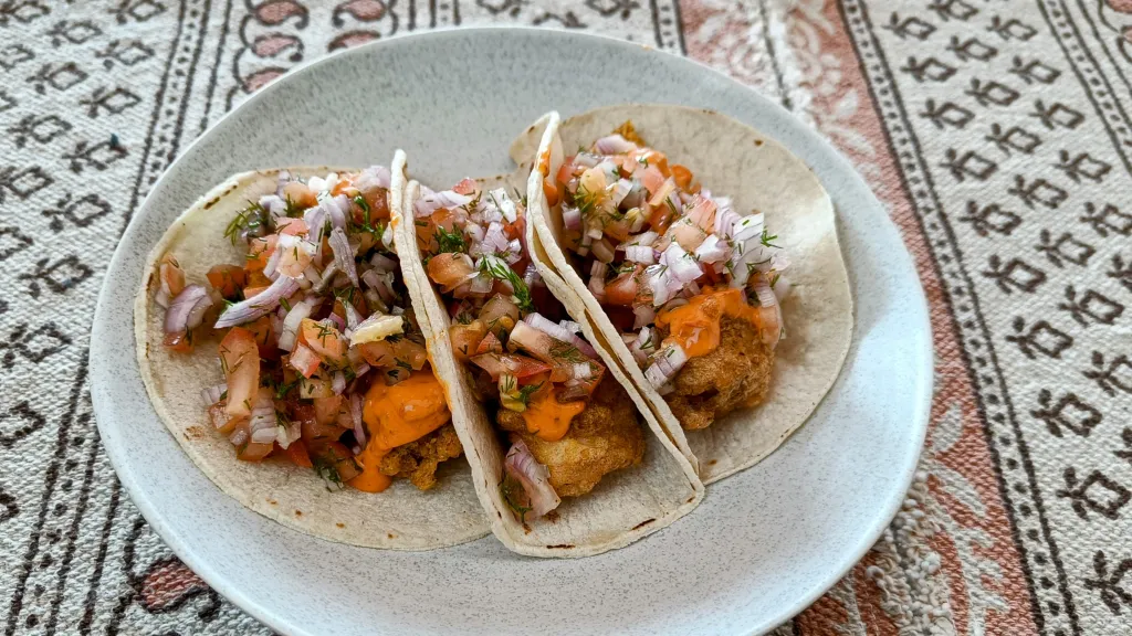 Photograph of Crispy cod wraps with salsa & harissa lime mayo.