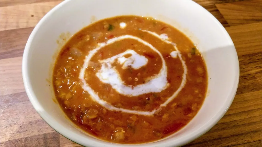 Photograph of Curried lentil, tomato and coconut soup.