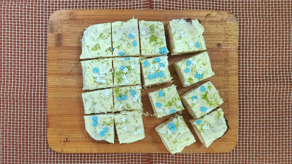 Photograph of Frosted lemon-lime sugar cookie bars.