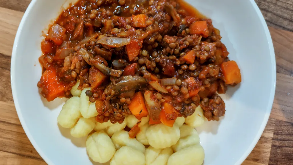Photograph of Gnocchi with mushroom-lentil ragu.