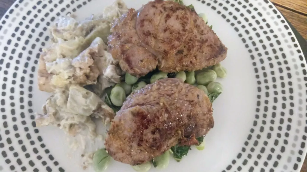 Photograph of Greek lamb with smoked aubergine & minty broad beans.