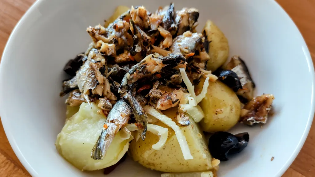 Photograph of Grilled harissa sardines with fennel & potato salad.