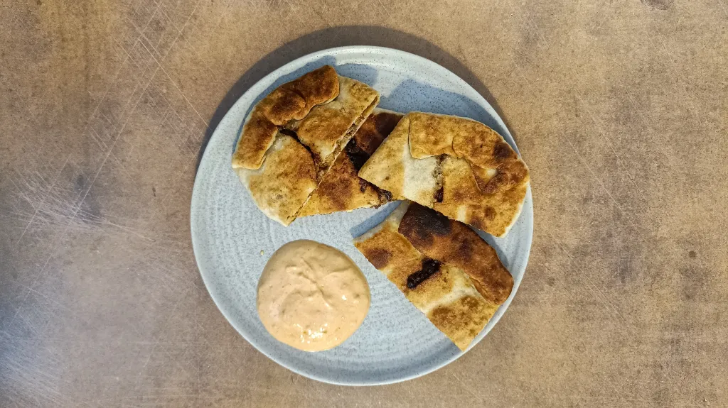 Photograph of Harissa beef msemen.