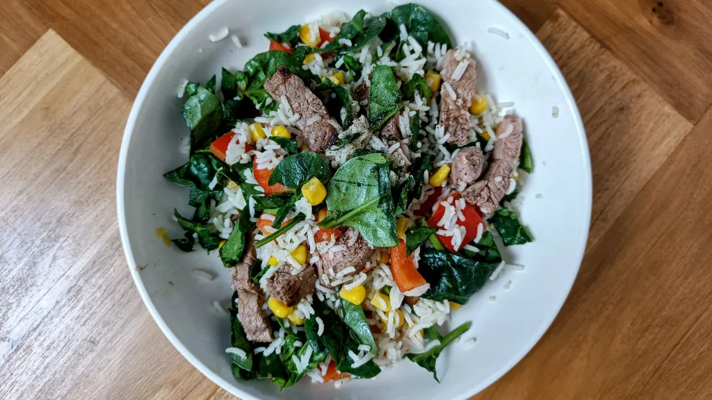 Photograph of Harissa lamb and rice salad.