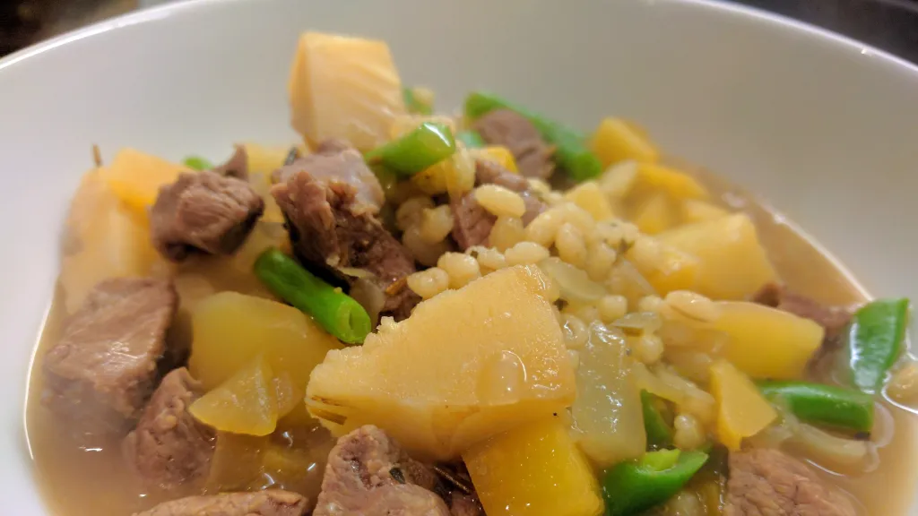 Photograph of Hearty lamb & barley soup.