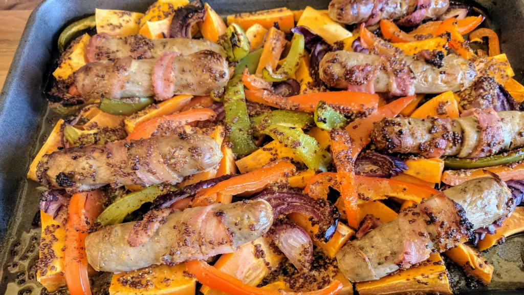 Photograph of Honey-mustard sausage, bacon and sweet potato bake.