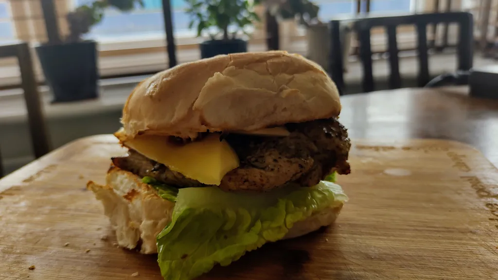 Photograph of Jerk chicken burger.