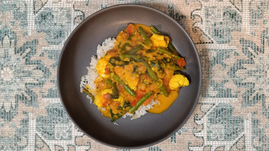 Photograph of Keralan monkfish curry with coconut rice.