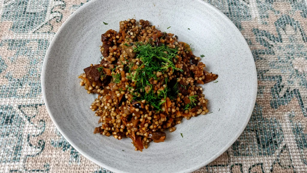 Photograph of Lamb & buckwheat pilaf with cherries, chestnuts & dill.