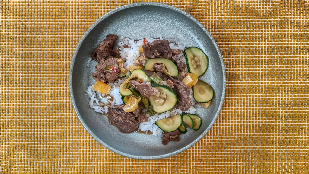 Photograph of Lamb, courgette & orange stir-fry.