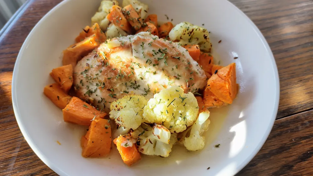 Photograph of Lemony chicken with roast veg and olives.