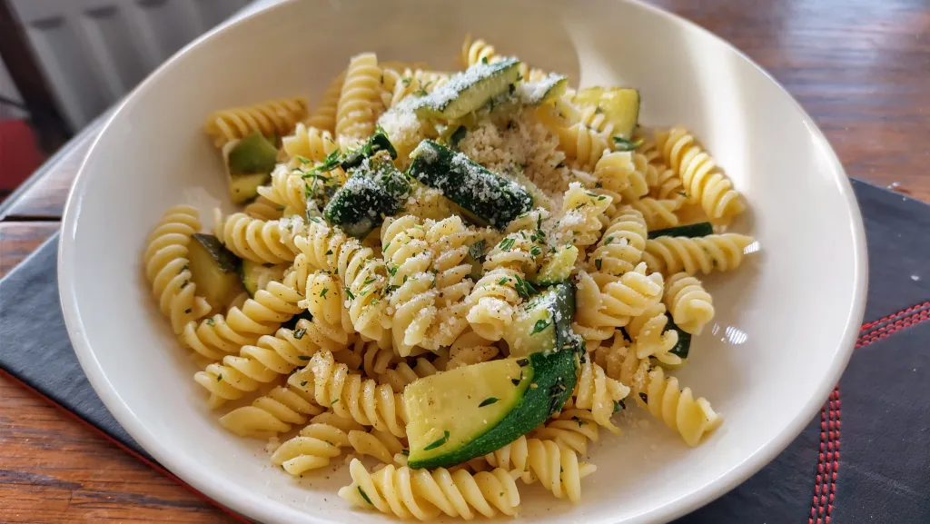 Photograph of Lemony pasta with zucchini and fresh herbs.