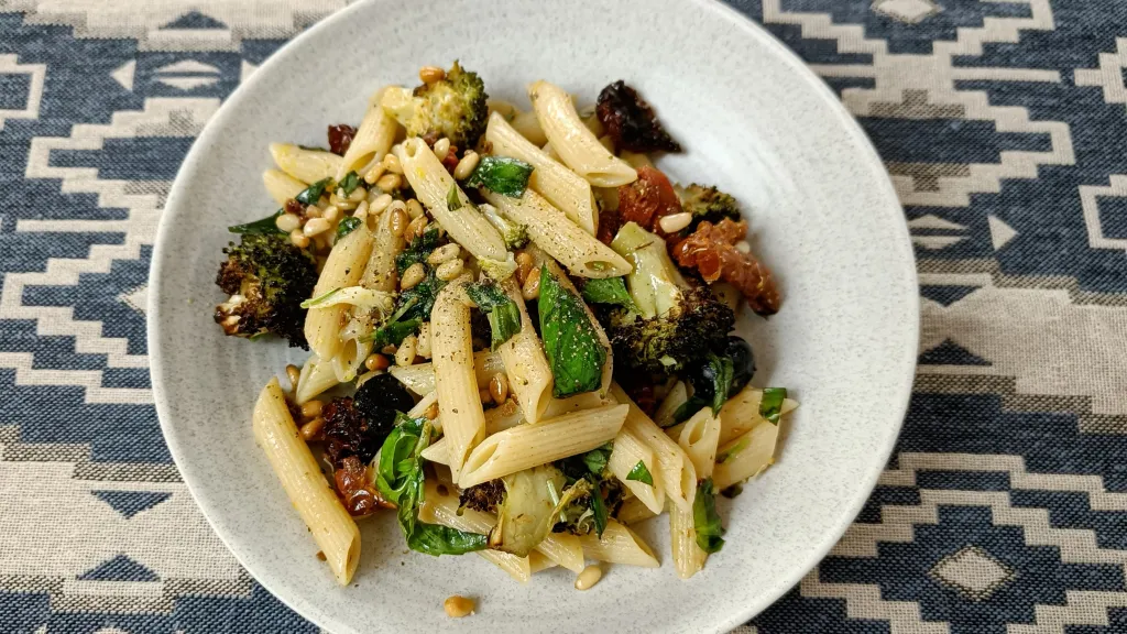 Photograph of Lunchbox pasta salad: quick-roast broccoli with olives, sun-dried tomatoes, basil & pine nuts.