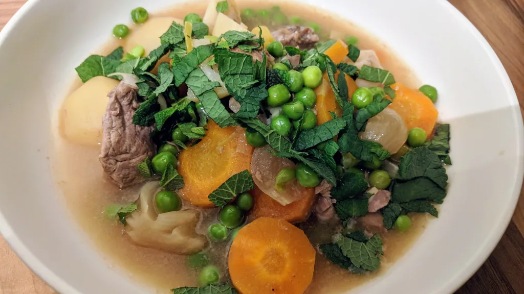 Photograph of Minted lamb & pea stew.