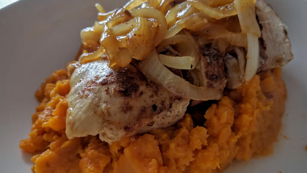 Photograph of Moroccan chicken with sweet potato mash.