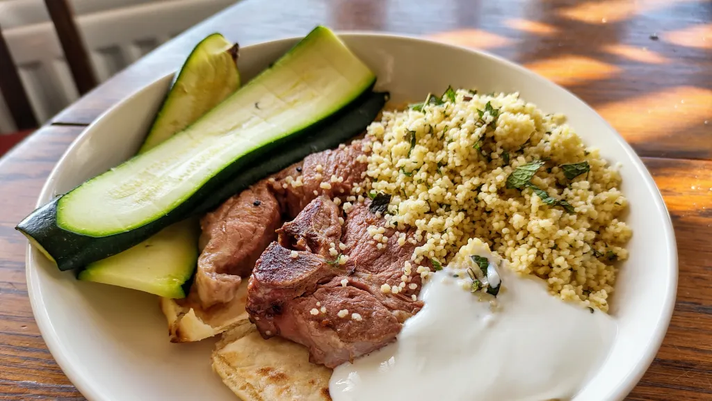 Photograph of Moroccan lamb salad with jewelled couscous.