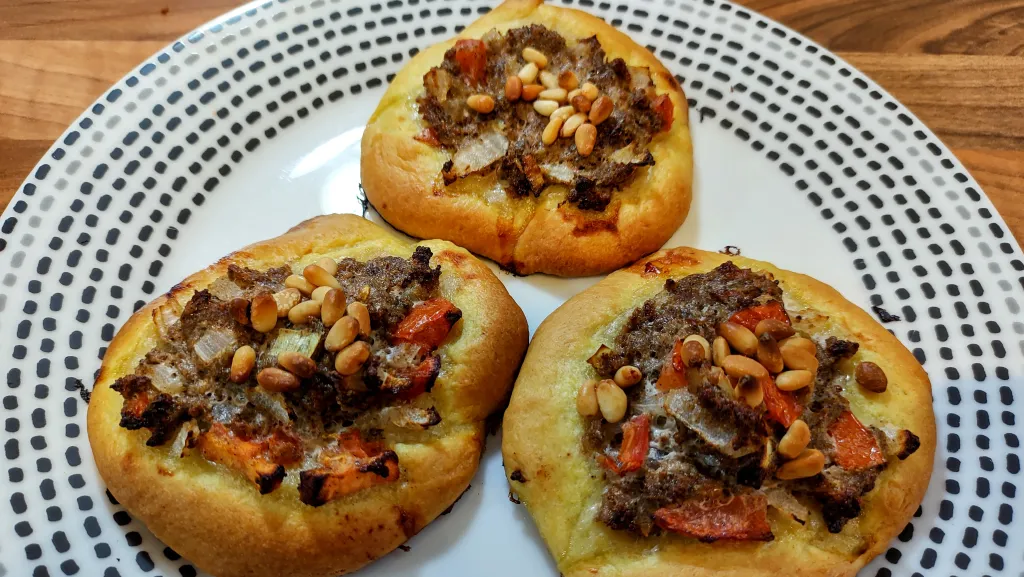 Photograph of Open meat pies.