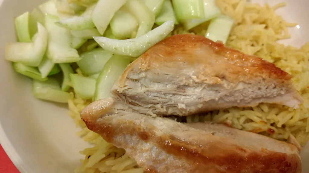 Photograph of Pan fried chicken with lime & coconut sauce.