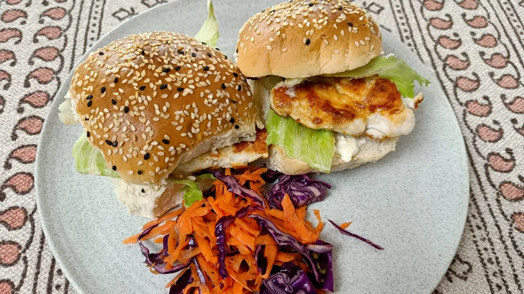 Photograph of Parmesan chicken butties with red cabbage slaw.