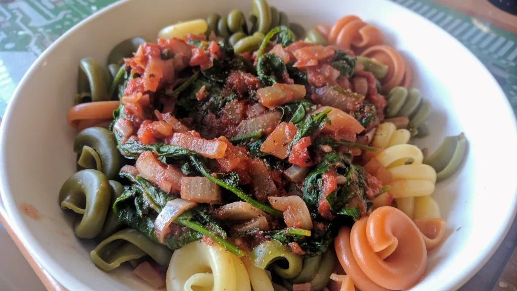 Photograph of Pasta with chilli tomatoes & spinach.