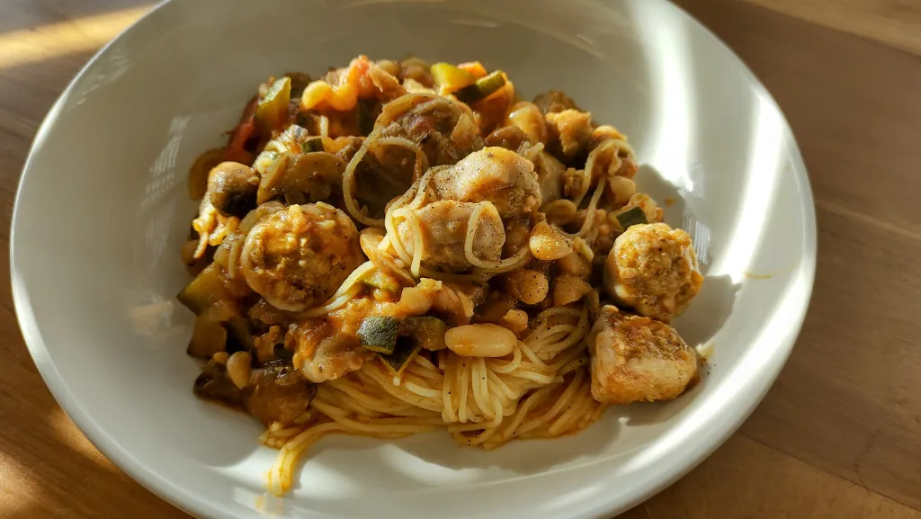 Photograph of Pasta with sausage and white beans.
