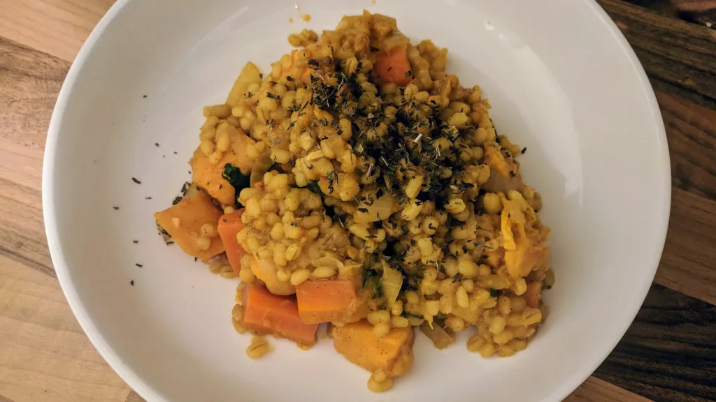 Photograph of Pearl barley, parsnip & preserved lemon tagine.