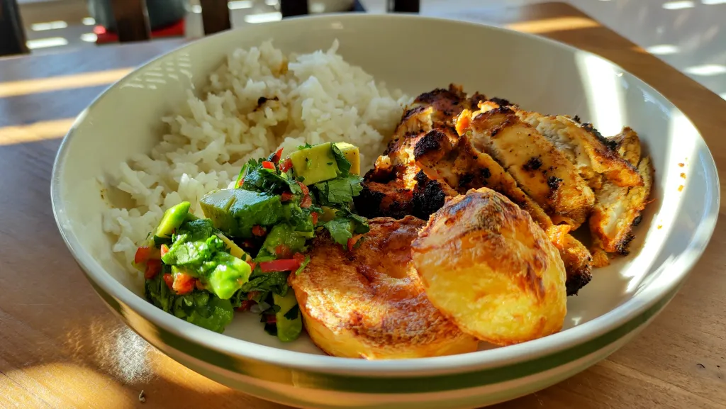 Photograph of Peruvian chicken bowl with potatoes.
