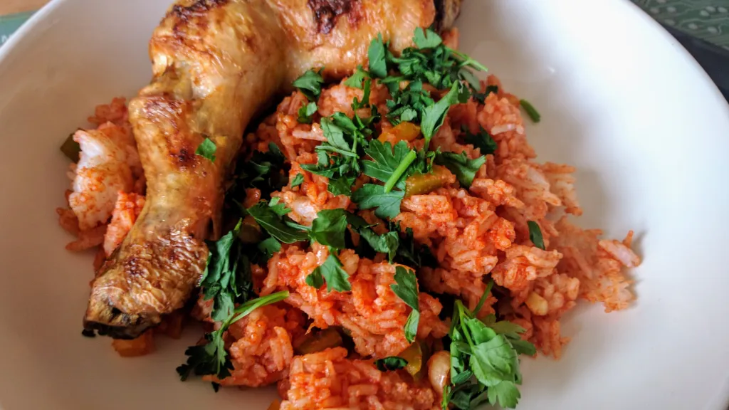 Photograph of Piri-piri chicken with spicy rice.