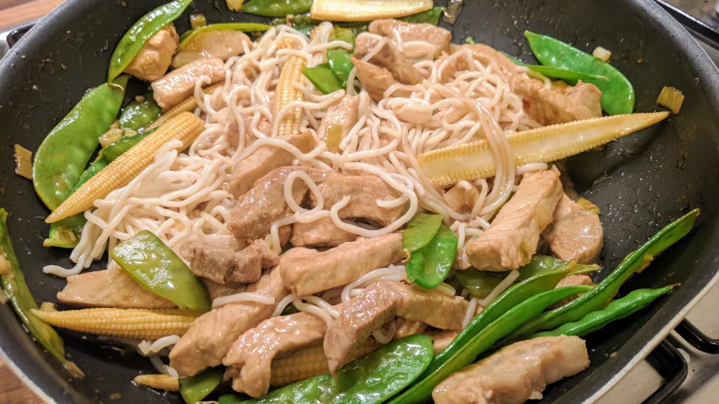 Photograph of Pork and noodle stir fry.