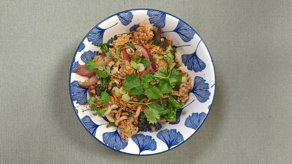 Photograph of Pork and purple broccoli udon.
