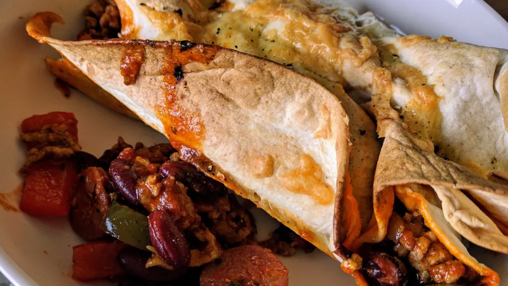 Photograph of Pork & chorizo enchiladas.