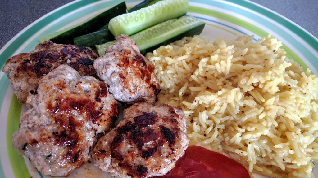 Photograph of Pork patties with chilli dipping sauce.